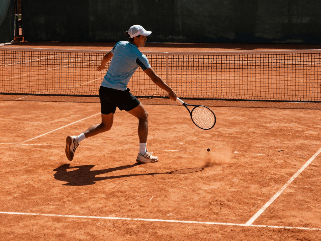On a sunlit clay court at a seaside club in Barcelona, a sprinting opponent flashes a sharp forehand as chalk erupts from the baseline. Shot