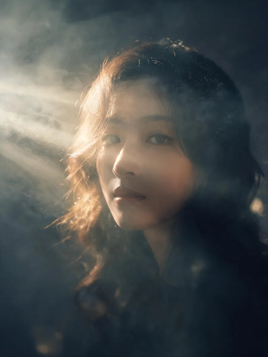 Cinematic portrait with volumetric lighting and atmospheric haze