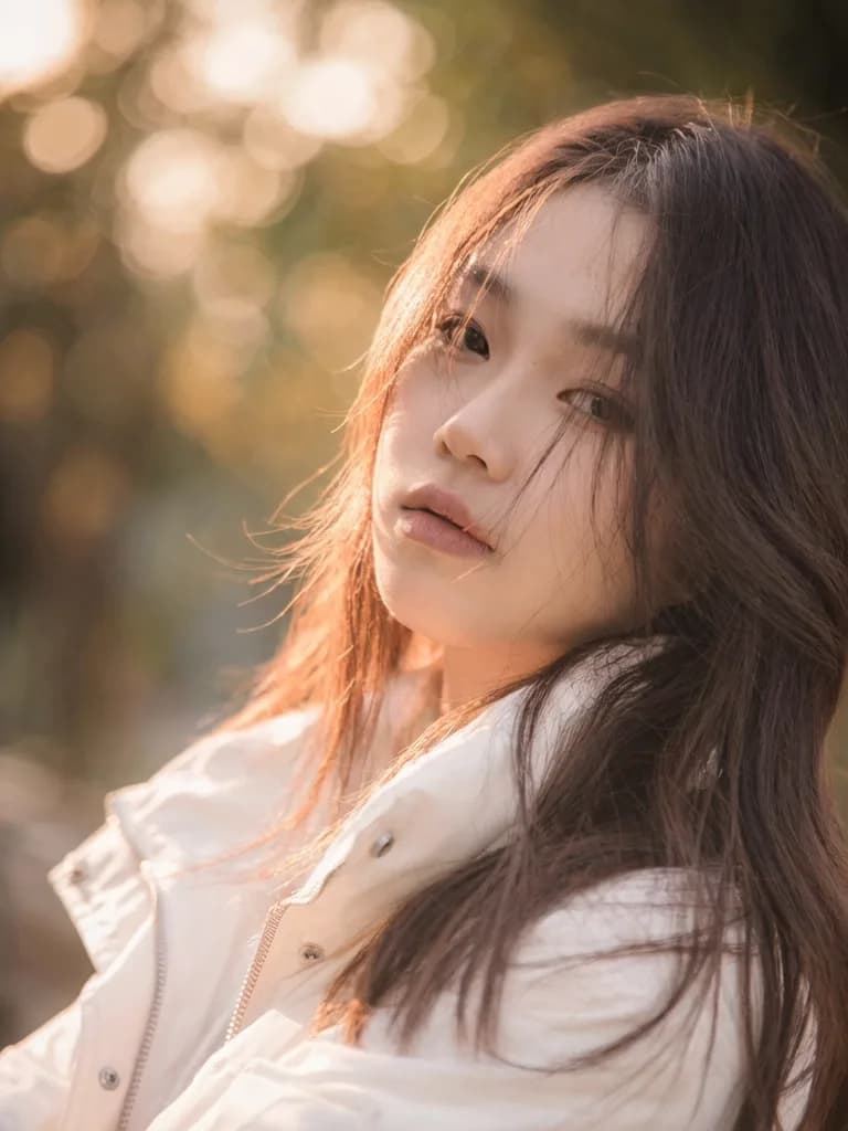 Photorealistic portrait with bokeh background and golden hour lighting