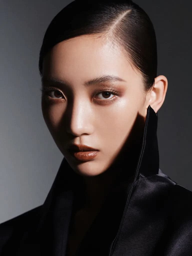 Studio fashion photography with dramatic side lighting